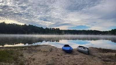 kayaks on the beach at Curlew Pond